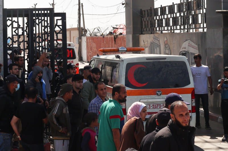 One of the ambulances carrying the bodies of staff members of the U.S.-based aid group World Central Kitchen arrives at the Rafah crossing with Egypt in the southern Gaza Strip on Wednesday. Photo by Ismael Mohamad/UPI