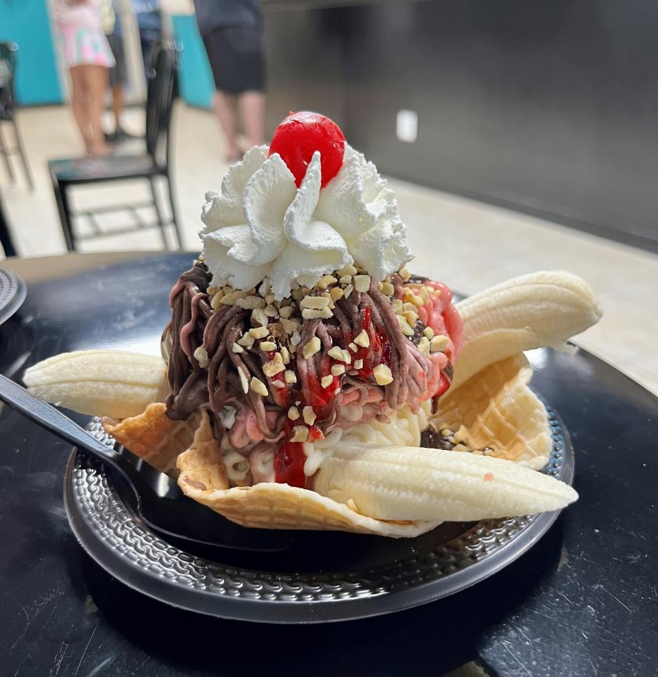 Holy Moly's banana split is made with strawberry, vanilla and chocolate gelato, whipped cream,  chocolate and strawberry sauce, nuts, chocolate flakes and a banana.