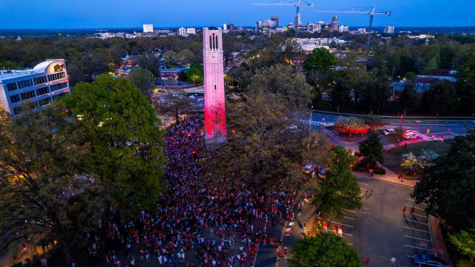 NC State fans celebrate at the Memorial Belltower on campus after the men’s basketball team’s 76-64 win over Duke to advance to the Final Four in the NCAA Men’s Division I Basketball Tournament on Sunday, March 31, 2024.