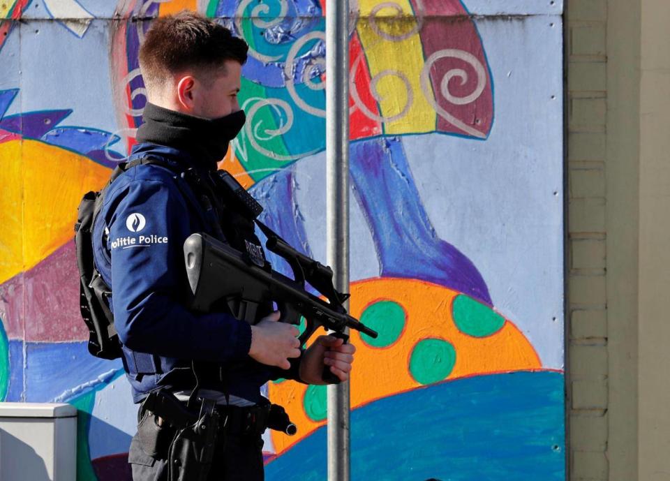 A Belgian police special forces member secures a street after an area of the Forest commune in Brussels was put on lockdown (REUTERS)