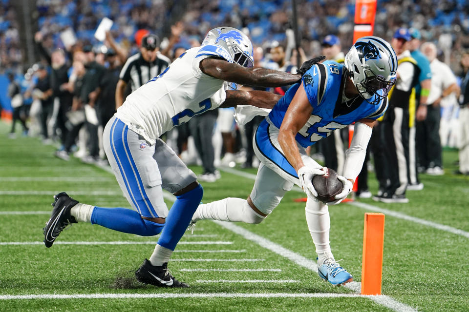 Carolina Panthers wide receiver Adam Thielen scores past Detroit Lions cornerback Will Harris during the first half of a preseason NFL football game Friday, Aug. 25, 2023, in Charlotte, N.C. (AP Photo/Jacob Kupferman)