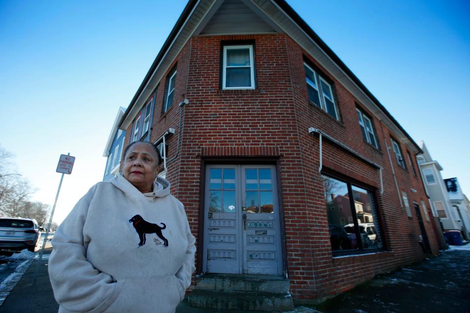 R. Carleen Cordwell stands in front of the future Underground Railroad Cafe & Gallery on Acushnet Avenue in New Bedford.