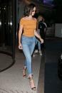 <p>In an orange off-the-shoulder sweater by C/Meo Collective, fringed skinny jeans, Giuseppe Zanotti’s “GEORGINA” Black Satin Strappy Sandal and sunglasses while out in Cannes.</p>