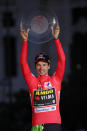 Primoz Roglic of Slovenia celebrates on the podium after winning La Vuelta cycling race in Madrid, Spain, Sunday, Sept. 15, 2019. (AP Photo/Manu Fernandez)