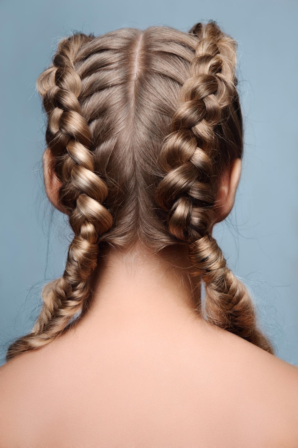 How to French braid hair; French braid pigtails (Getty Images stock)