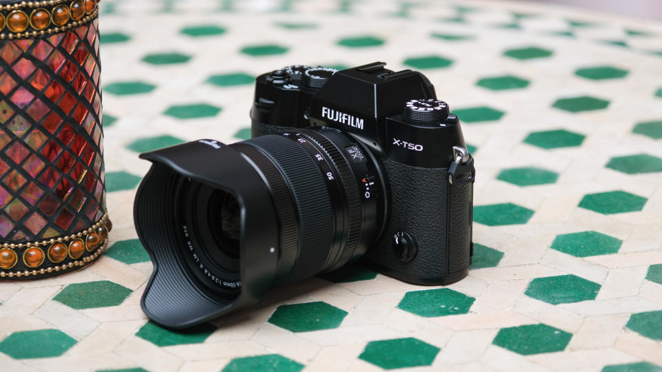 Fujifilm X-T50 camera on a green a white table