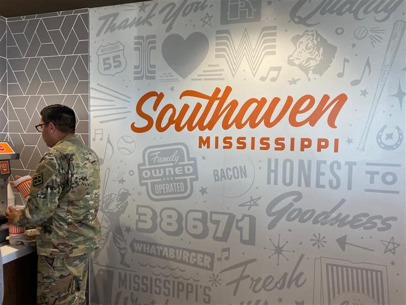 A Whataburger customer at the first Whataburger in the Memphis area waits to get his drink. The Whataburger Southaven location at 176 Goodman Road East opened it's doors at 11 a.m. Monday.