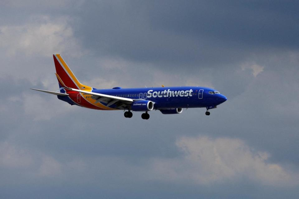 PHOTO: A Southwest Airlines commercial aircraft approaches to land at John Wayne Airport in Santa Ana, California, Jan. 18, 2022. (Mike Blake/Reuters)