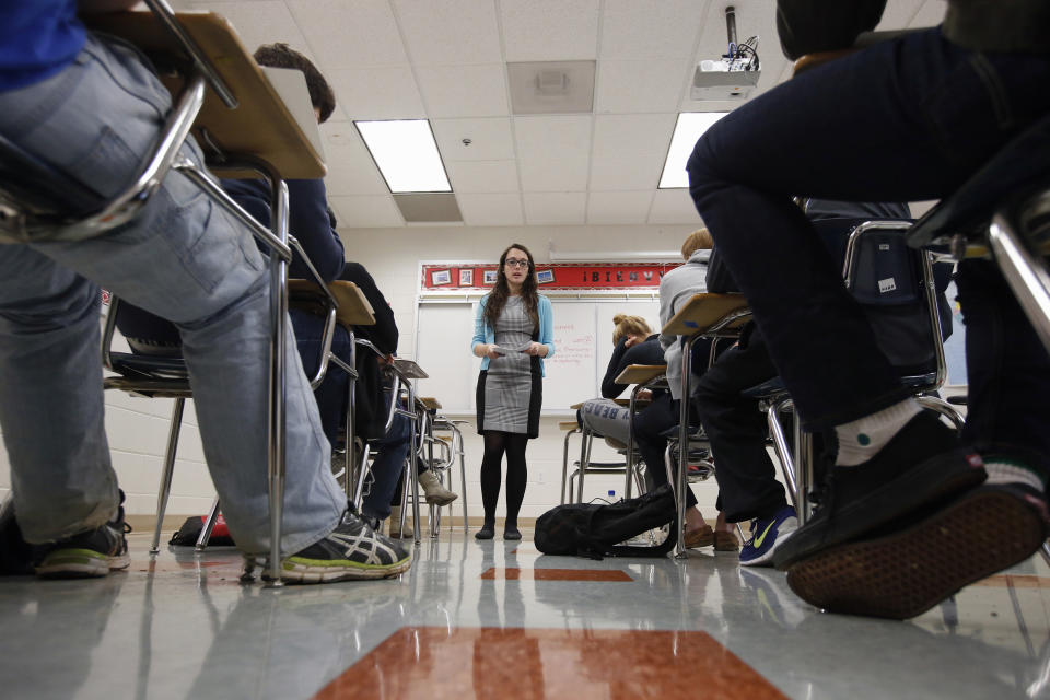 In this photo taken Jan. 17, 2016, Katerina Maylock, with Capital Educators, teaches a college test preparation class at Holton Arms School in Bethesda. The current version of the SAT college entrance exam is having its final run, when thousands of students nationwide will sit, squirm or stress through the nearly four-hour reading, writing and math test. A new revamped version debuts in March. (AP Photo/Alex Brandon)