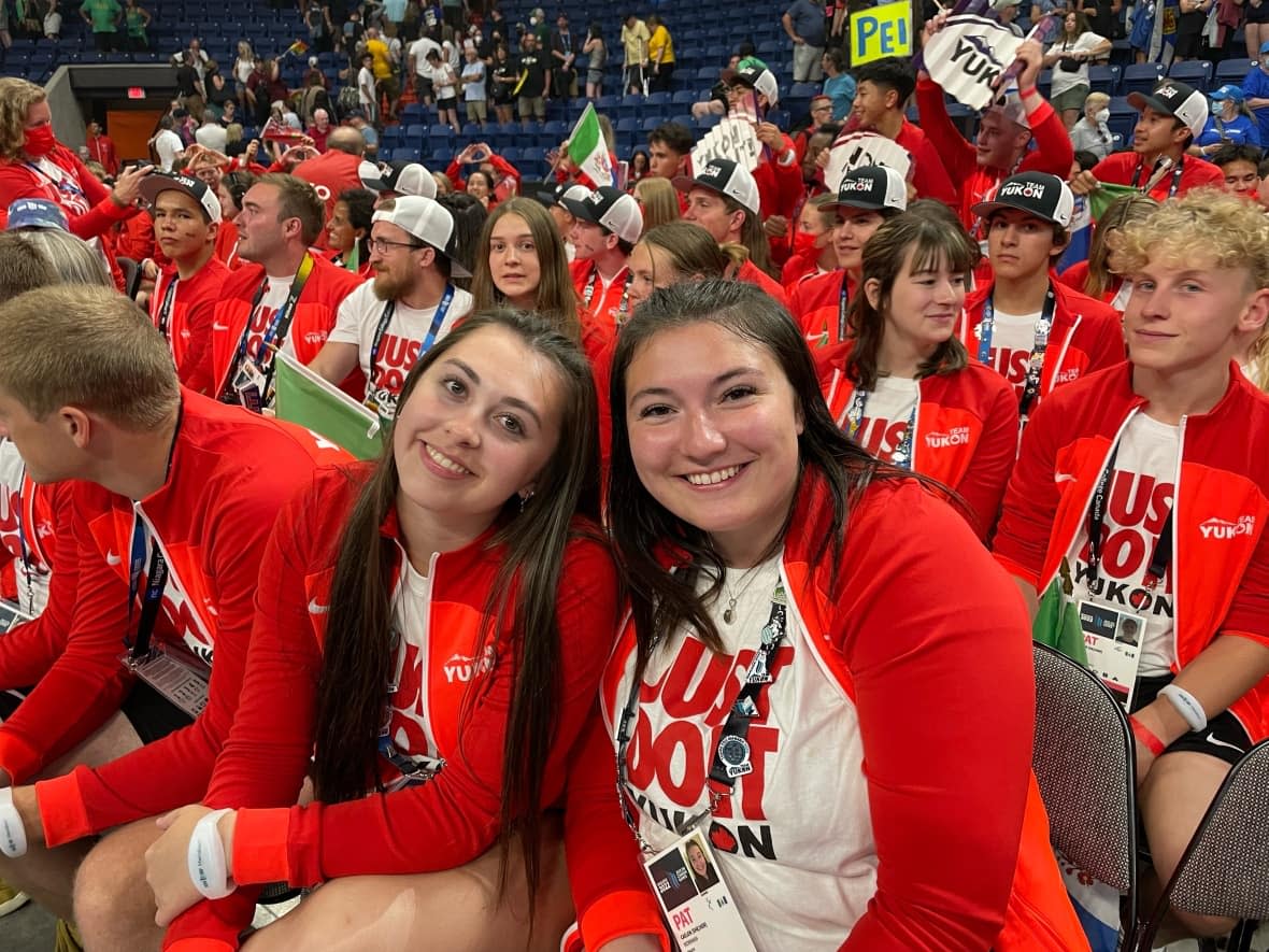 Paige Poelman, left, and Caelon Workman, the women's beach volleyball team from the Yukon, attend the recent opening ceremony of the 2022 Canada Summer Games in Ontario's Niagara Region. (Shannon Poelman/Supplied - image credit)