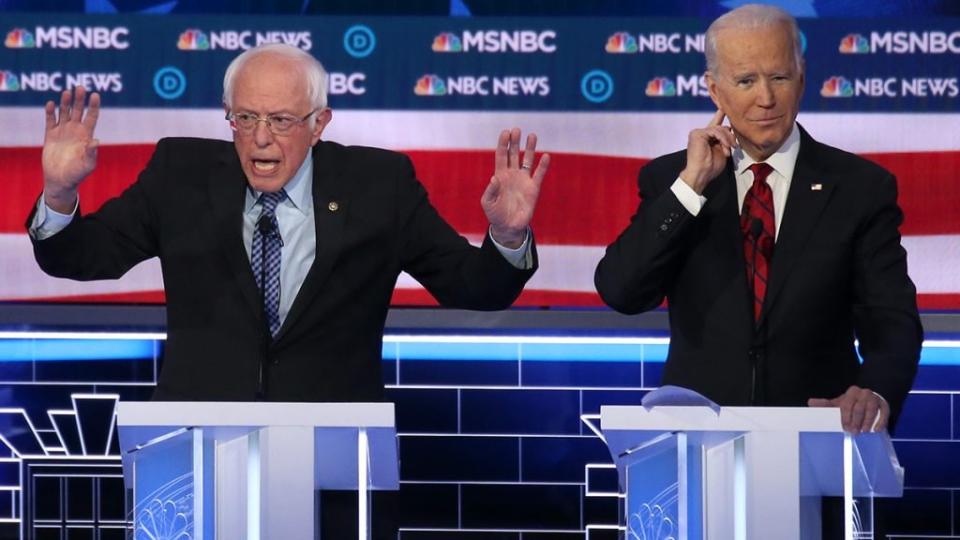 Democratic presidential candidate Sen. Bernie Sanders (I-VT) (L), speaks as former Vice President Joe Biden gestures during the Democratic presidential primary debate at Paris Las Vegas on February 19, 2020 in Las Vegas, Nevada. (Photo by Mario Tama/Getty Images)