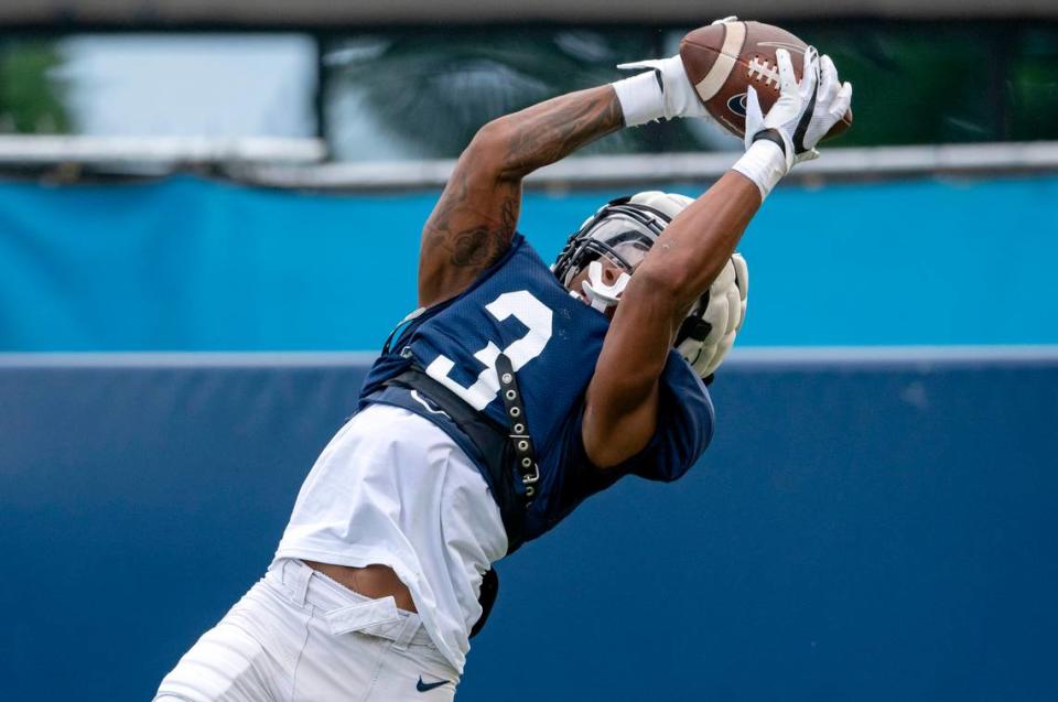 Penn State cornerback Johnny Dixon intercepts a pass during practice on Wednesday, Aug. 10, 2022.