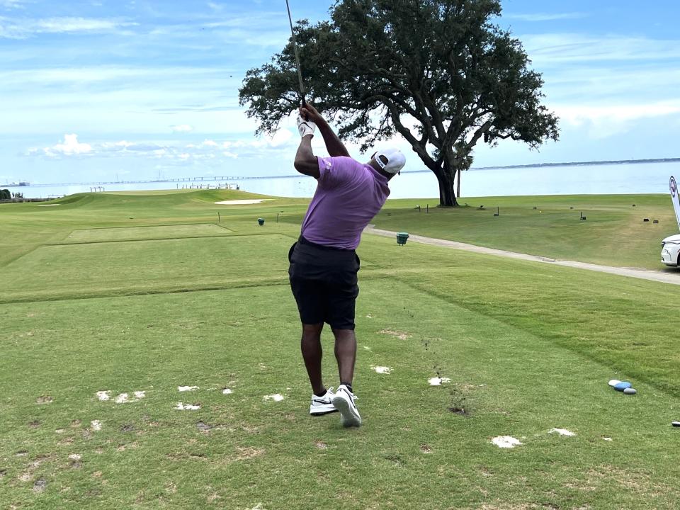 Derrick Brooks hits his tee shot on the closing No. 18 hole at Pensacola Country Club on Monday, Aug. 8, 2022 during the Derrick Brooks Charities Golf Tournament.