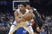 Orlando Magic guard Gary Harris, left, steals the ball from Portland Trail Blazers guard Anfernee Simons (1) during the first half of an NBA basketball game, Monday, Jan. 17, 2022, in Orlando, Fla. (AP Photo/Phelan M. Ebenhack)