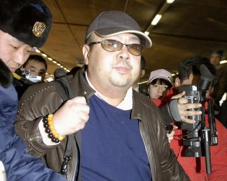 FILE PHOTO - Kim Jong Nam arrives at Beijing airport in Beijing, China, in this photo taken by Kyodo February 11, 2007. Mandatory credit Kyodo/via REUTERS/File Picture.