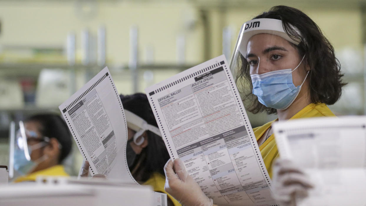 Vivian Morales checks a ballot in San Bernardino, Calif., before sending it in to be tallied at the County Registrar of Voters office in November last year.