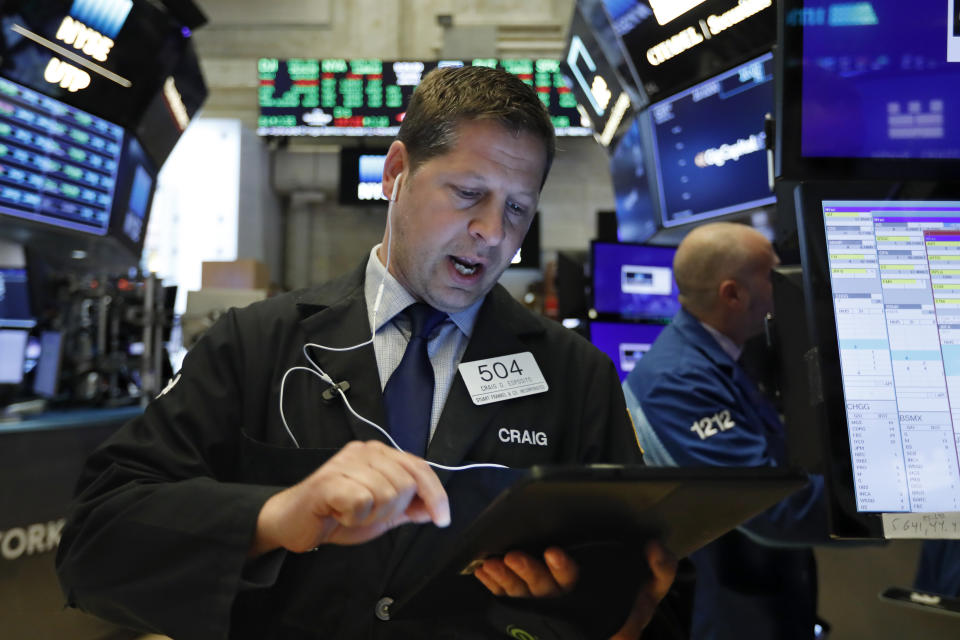 Trader Craig Esposito works on the floor of the New York Stock Exchange, Tuesday, June 11, 2019. Stocks are rising early Tuesday as Wall Street continues to thrive in June. (AP Photo/Richard Drew)