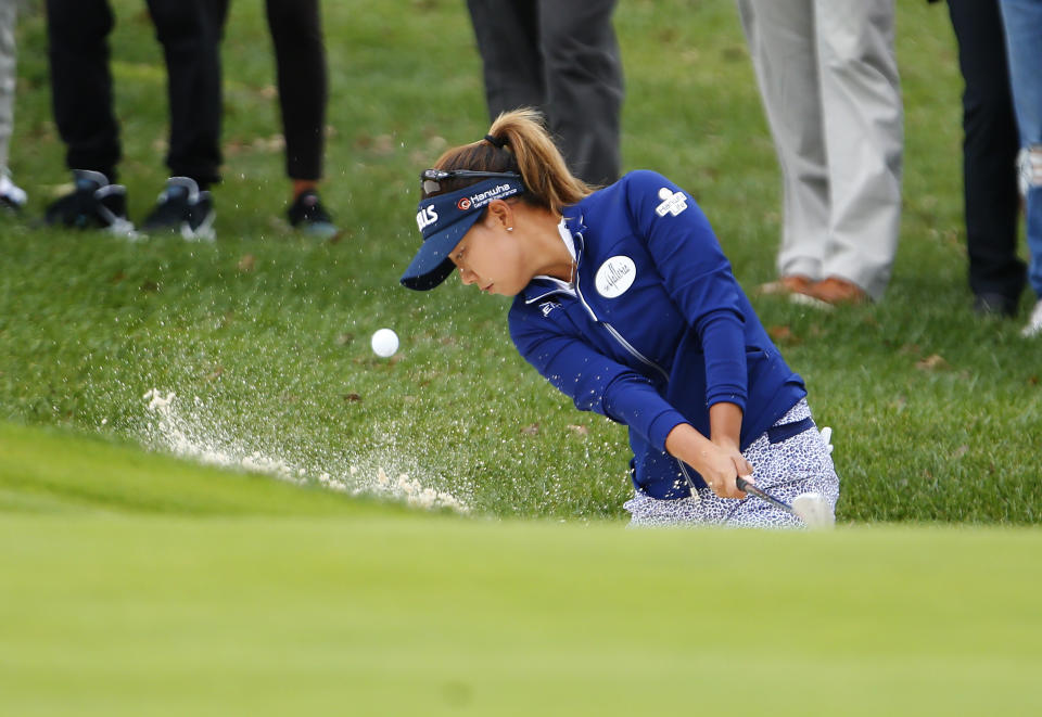 CORRECTS NAME TO JENNY SHIN INSTEAD OF CHELLA CHOI - Jenny Shin, of South Korea, hits out of a trap at the first hole during the third round of the Cognizant Founders Cup golf tournament, Saturday, Oct. 9, 2021, in West Caldwell, N.J. (AP Photo/Noah K. Murray)