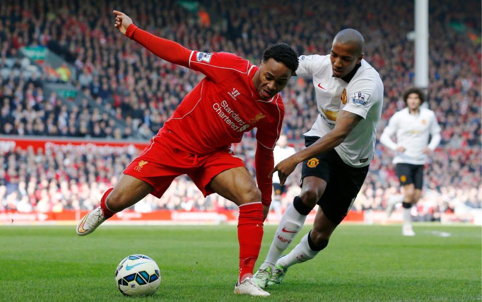 Manchester United's Ashley Young in action with Liverpool's Raheem Sterling - Reuters/Phil Noble