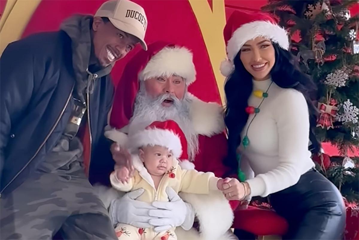 Nick Cannon poses with Santa for a Christmas photo alongside Bre Tiesi