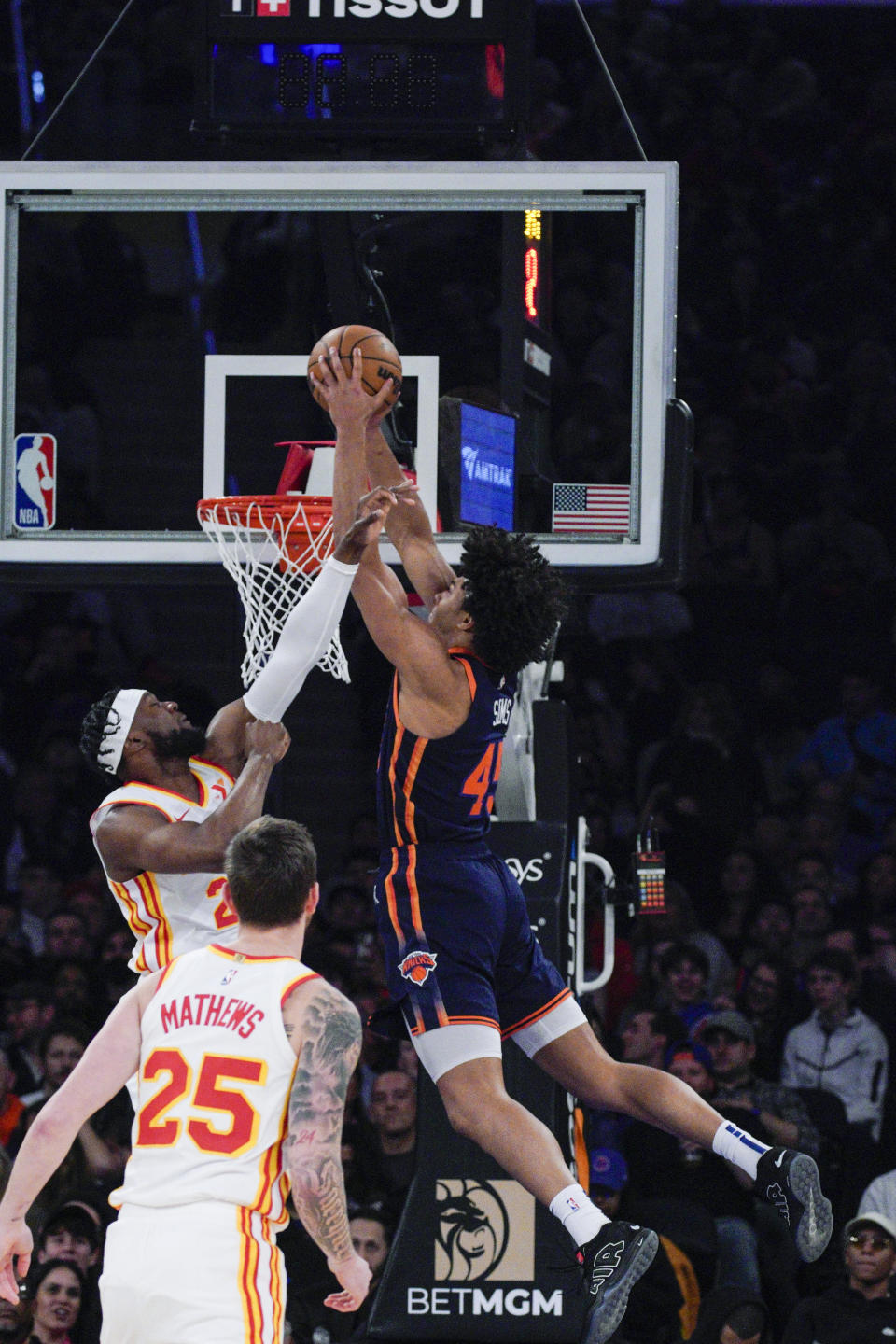 New York Knicks center Jericho Sims (45) dunks against Atlanta Hawks forward Bruno Fernando (24) during the first half of an NBA basketball game Tuesday, March 5, 2024, in New York. (AP Photo/Eduardo Munoz Alvarez)