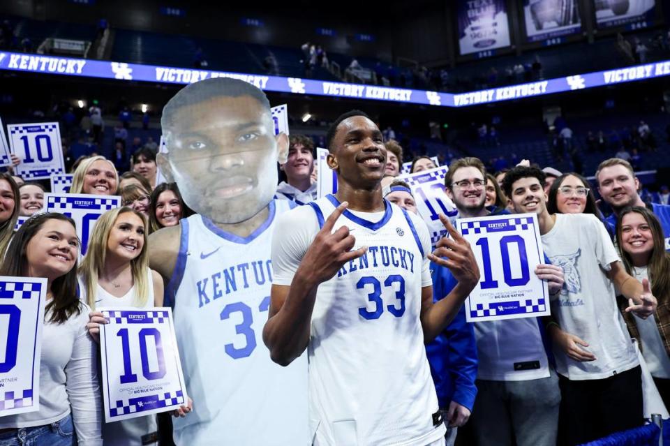 Kentucky sophomore Ugonna Onyenso takes a photo with the student section after recording 10 blocks against Mississippi on Feb. 13 at Rupp Arena.