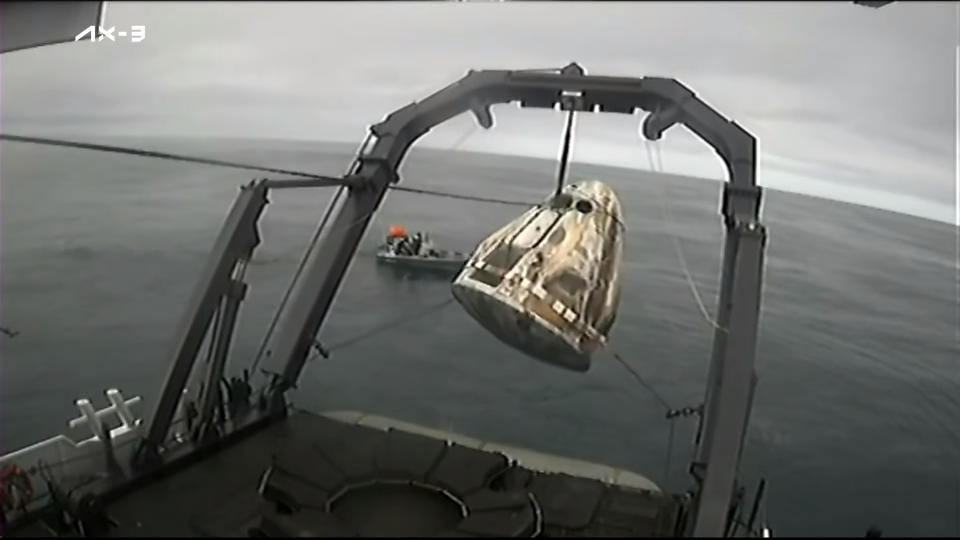 A SpaceX Dragon capsule carrying the Ax-3 astronauts is recovered from the Atlantic Ocean after splashdown on Feb. 9, 2024.