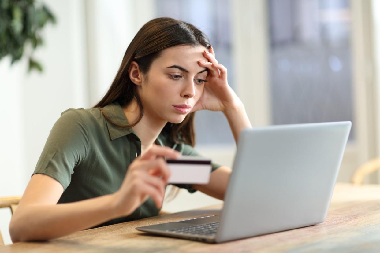 Worried woman having problem buying online
