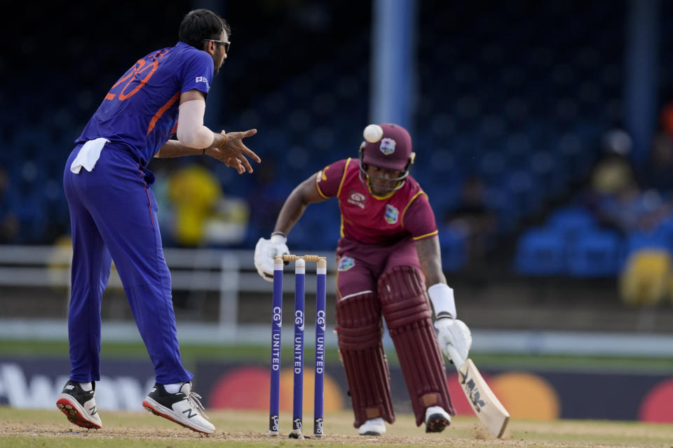 West Indies' Keacy Carty safely makes to the wicket as India's Axar Patel fields during the third ODI cricket match at Queen's Park Oval in Port of Spain, Trinidad and Tobago, Wednesday, July 27, 2022. (AP Photo/Ricardo Mazalan)
