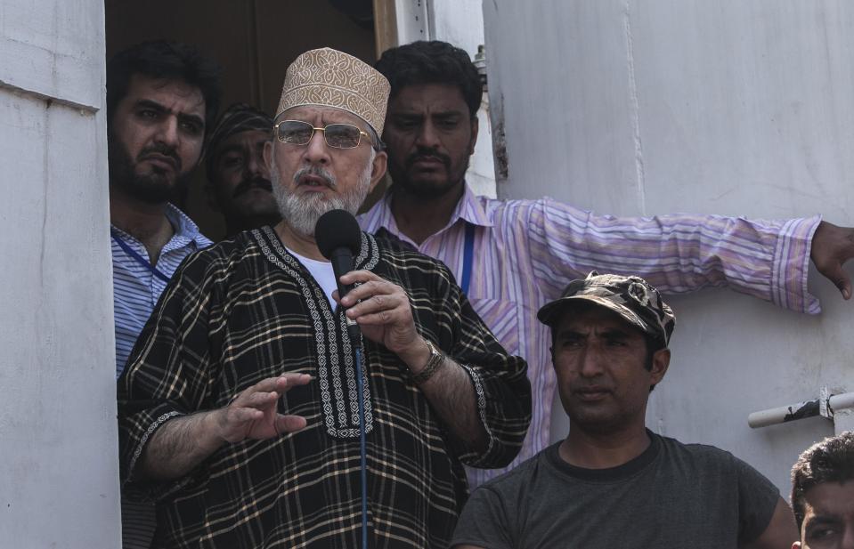 Tahir ul-Qadri, Sufi cleric and leader of political party Pakistan Awami Tehreek (PAT),addresses supporters during the Revolution March in Islamabad August 31, 2014. Thousands of protesters massed outside the residence of Pakistani Prime Minister Nawaz Sharif on Saturday to demand he step down, after efforts to find a negotiated solution to the country's political crisis failed.Pakistan has been gripped by unrest for more than two weeks, with protest leaders Imran Khan and Tahir ul-Qadri saying they will not back back down unless Prime Minister Nawaz Sharif resigns. On Saturday Sharif once again said he would not go. (REUTERS/Akhtar Soomro)