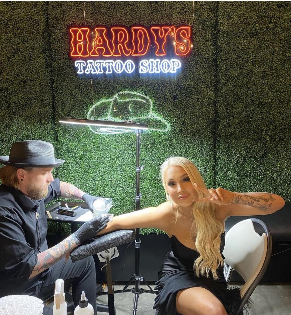 RaeLynn gets a tattoo at HARDY's wedding 10/29/22