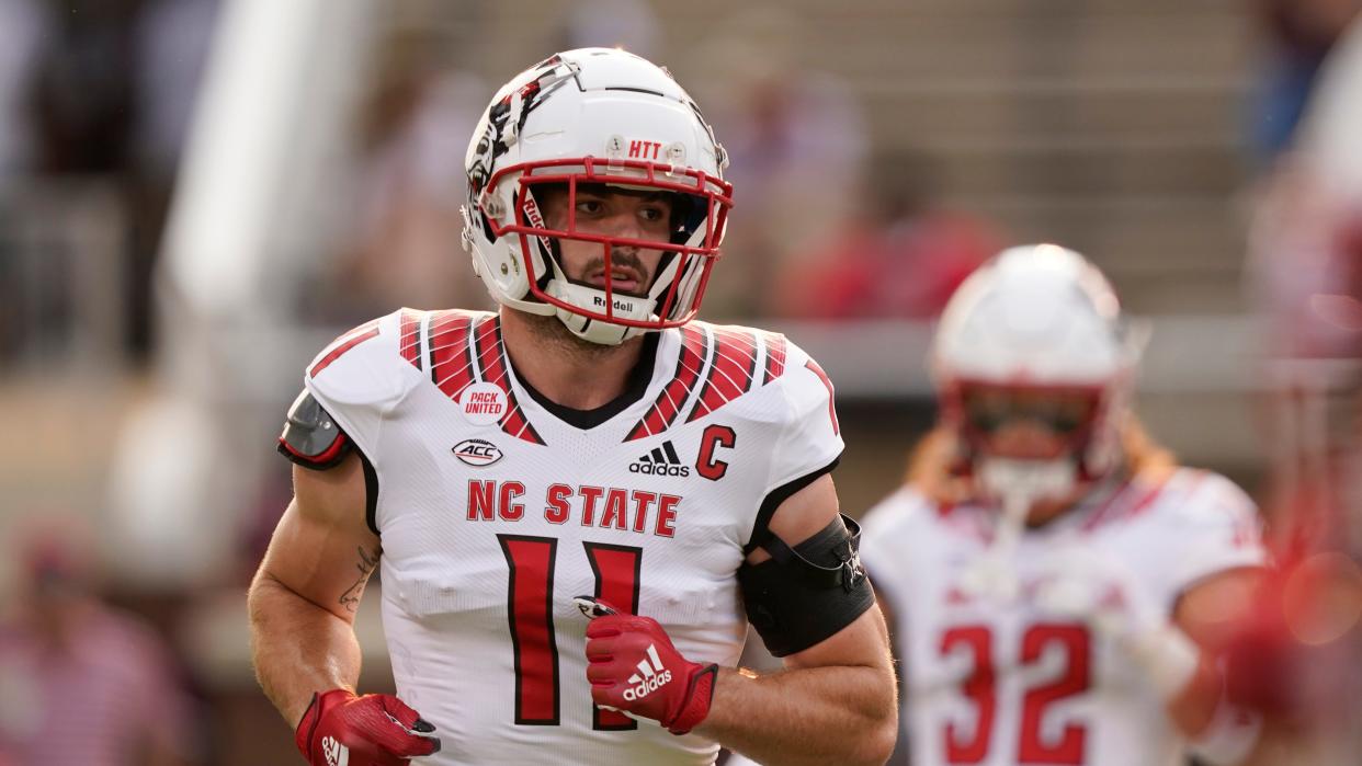 North Carolina State linebacker Payton Wilson (11) runs during warmups prior to their NCAA college football game against Mississippi State in Starkville, Miss., Saturday, Sept. 11, 2021. Mississippi State won 24-10. (AP Photo/Rogelio V. Solis)