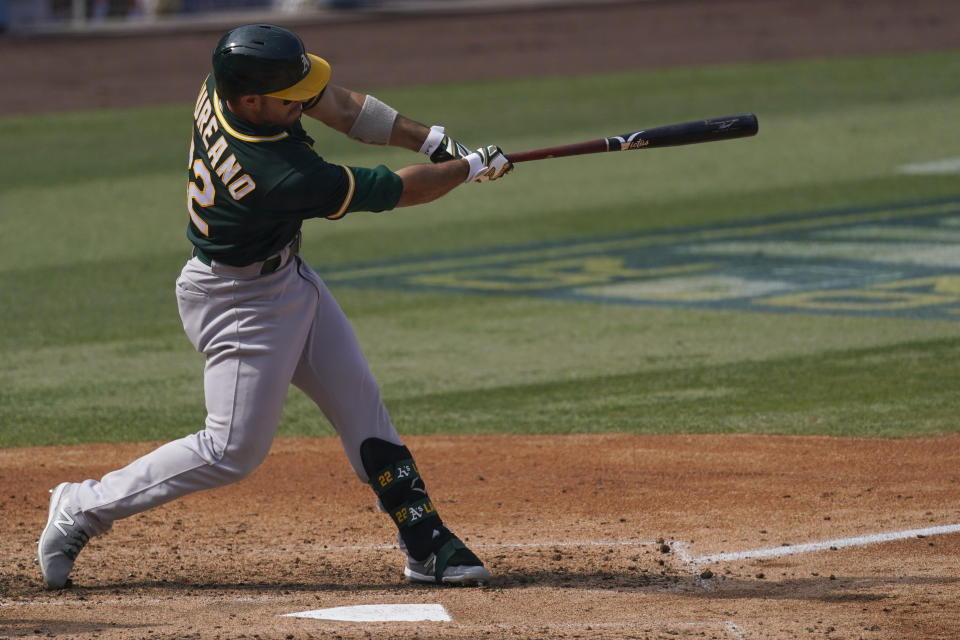 Oakland Athletics' Ramon Laureano hits a solo home run against the Houston Astros during the fifth inning of Game 4 of a baseball American League Division Series in Los Angeles, Thursday, Oct. 8, 2020. (AP Photo/Ashley Landis)