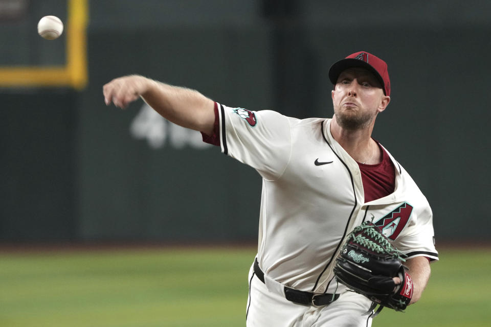 Arizona Diamondbacks pitcher Merrill Kelly throws against the San Diego Padres in the first inning during a baseball game, Friday, Sept. 27, 2024, in Phoenix. (AP Photo/Rick Scuteri)