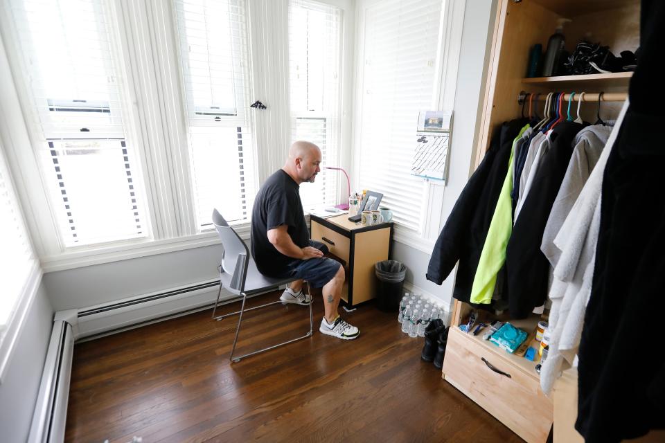 Army veteran Willy Lake sits in his apartment at the new Veterans Transition House in New Bedford. Lake has dealt with addiction to cocaine and alcohol for much of his life and credits the Veterans Transition House for saving him.