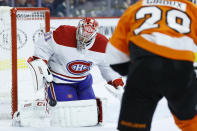 Montreal Canadiens' Carey Price, left, blocks a shot past Philadelphia Flyers' Claude Giroux during the second period of an NHL hockey game, Thursday, Jan. 16, 2020, in Philadelphia. (AP Photo/Matt Slocum)