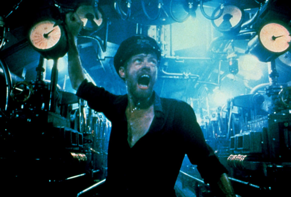 A sweaty man in a submarine screams, and he's surrounded by several gauges