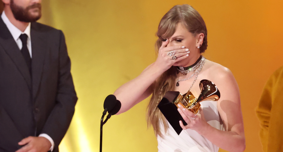 Taylor Swift accepts her Album of the Year Award for Midnights at the 66th GRAMMY Awards. 