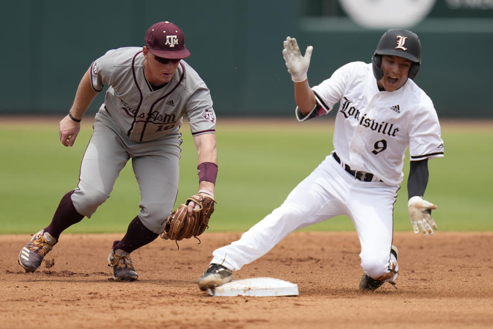 Louisville's Christian Knapczyk (9) reacts as he slides safely into second with a double as Texas A&M infielder Ryan Targac (16) tries to apply a late tag during an NCAA college baseball super regional tournament game Saturday, June 11, 2022, in College Station, Texas. (AP Photo/Sam Craft)