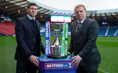 Rangers' Manager Steven Gerrard and Celtic Manager Neil Lennon with the Betfred League Cup Trophy during Managers Call at Hampden Stadium, Glasgow. - Credit: Luke Nickerson/Rangers FC via Press Association