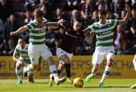 Britain Football Soccer - Heart of Midlothian v Celtic - Scottish Premiership - Tynecastle - 2/4/17 Celtic's Stuart Armstrong (L) and Celtic's Mikael Lustig in action with Heart's Jamie Walker Reuters / Russell Cheyne Livepic -