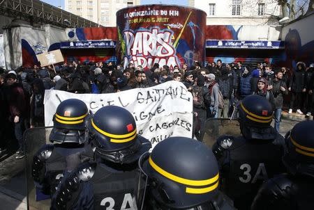 French CRS riot police face off with French high school and university students during a demonstration against the French labour law proposal in Paris, France, April 5, 2016 as the French Parliament will start to examine the contested reform bill. REUTERS/Pascal Rossignol