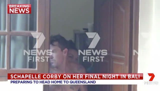 Corby can be seen peering over her brother's shoulder. Source: 7 News