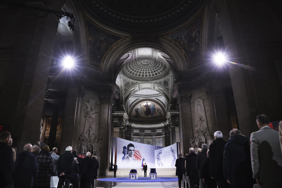 French President Emmanuel Macron pays his respects at the coffins of Missak Manouchian, and his wife Mélinée in the Pantheon monument during their induction ceremony, Wednesday, Feb 21, 2024 in Paris. While France hosts grandiose ceremonies commemorating D-Day, Missak Manouchian and his Resistance fighters' heroic role in World War II are often overlooked. A communist, poet who took refuge in France after surviving the Armenian genocide, Manouchian was executed in 1944 for leading the resistance to Nazi occupation. (Christophe Petit Tesson/Pool via AP)