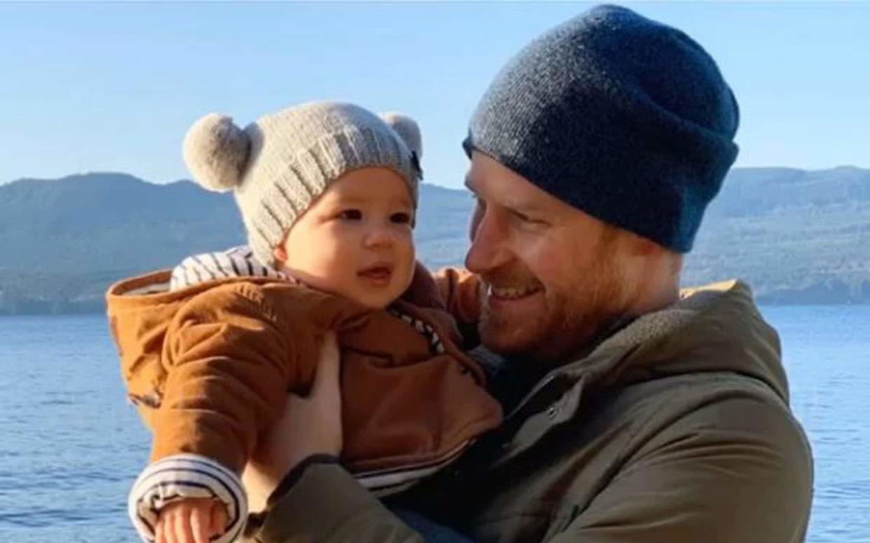 The Duke of Sussex holds his son son Archie Mountbatten-Windsor - PA