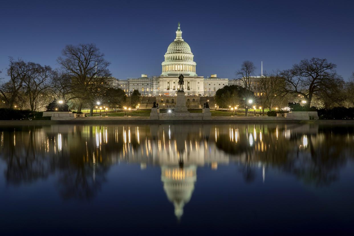 The U.S. Capitol building is seen before sunrise on Capitol Hill in Washington, Monday, March. 21, 2022. The Senate Judiciary Committee is set to begin its historic confirmation hearings for Judge Ketanji Brown Jackson. The 51-year-old federal judge would be the first Black woman on the Supreme Court.