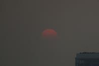 FILE PHOTO: The sunset is seen during a poor air quality day in Bangkok