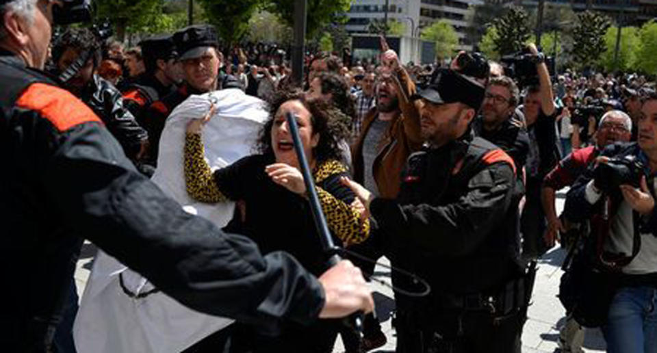 A protester breaks through a police line after a nine-year sentence was given to five men. Source: Reuters/Vincent West