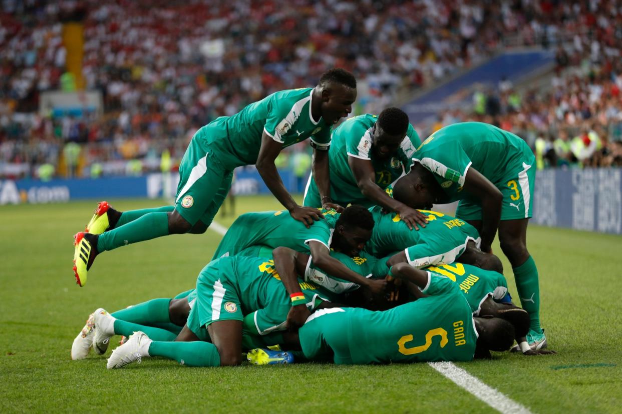 Senegal players celebrate during their 2-0 win over Poland: AP