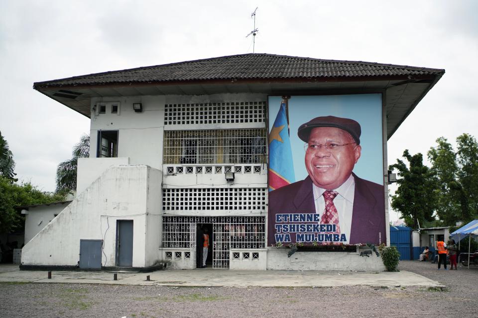 A giant portrait of UDPS presidential candidate Felix Tshisekedi is set on his party headquarters in Kinshasa, Congo, Tuesday Jan. 8, 2019, to participate in a general boxing and martial arts competition. As Congo anxiously awaits the outcome of the presidential election, many in the capital say they are convinced that the opposition won and that the delay in announcing results is allowing manipulation in favor of the ruling party. (AP Photo/Jerome Delay)